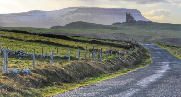 a castle on a hill Belfast and Wild Atlantic Way