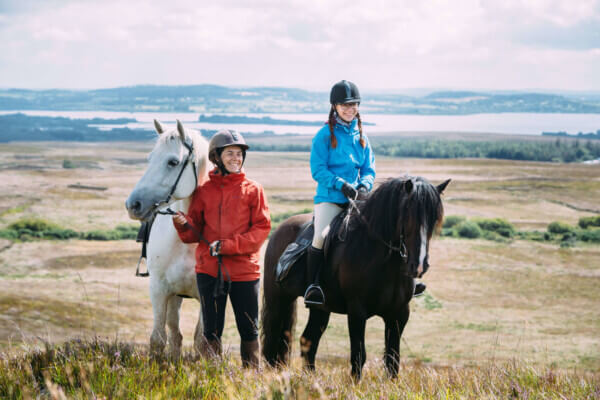 girls on horses in field is possible to get around Ireland without a car