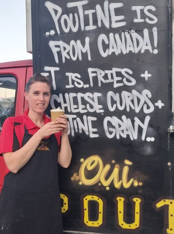 a woman holding a cup of coffee the top 20 Irish food trucks