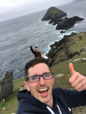 a man giving the thumbs up the 5 most awe-inspiring walks in Ireland