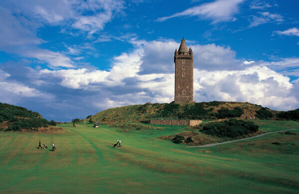 a tower in the middle of a golf course best affordable golf courses in Ireland
