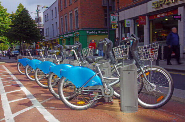 bikes parked on a street getting around Dublin by bus train and bike