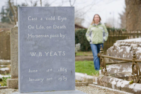 a girl standing near a tombstone Dublin to Sligo in 10 days