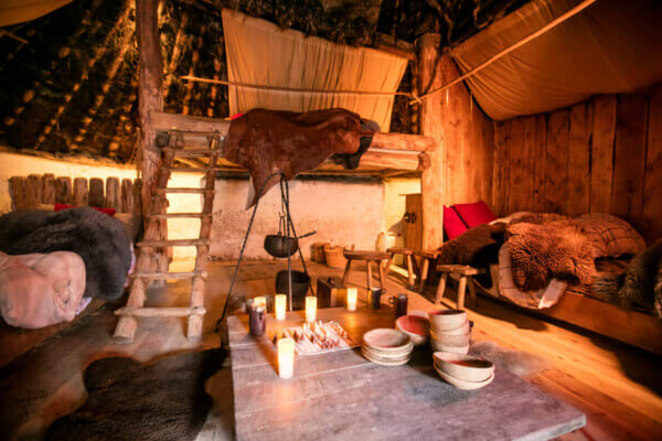 a room with bear skins and dishes on the table 7 cool places to stay in Ireland