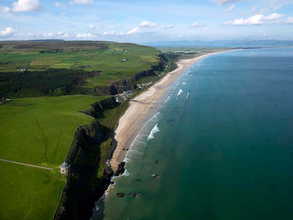 an aerial view of a beach in Northern Ireland Causeway Coastal Route