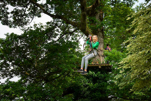 a girl zip lining Lough Key Forest Park