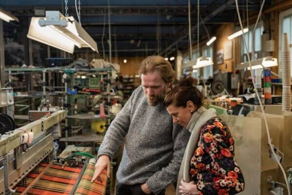 two people in a woollen mill finding the best authentic experiences in Ireland