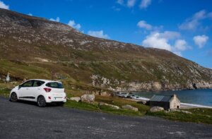 a car parked on the road renting a car to see Ireland