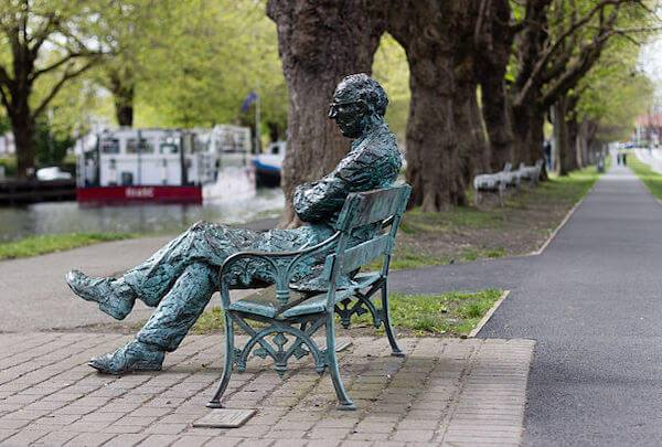 a statue on a bench 8 Irish writer attractions