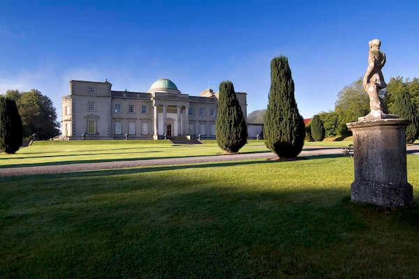 a large building and formal gardens Ireland's heritage sites