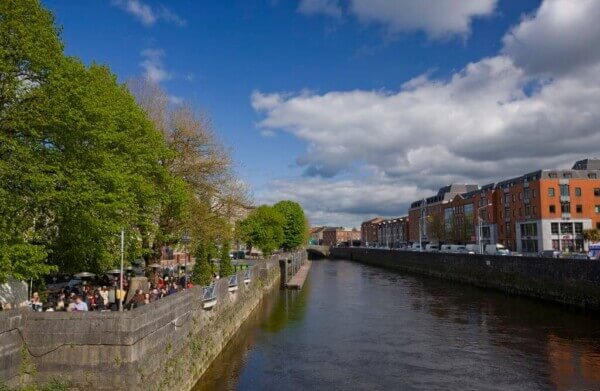 a river with buildings nearby annual festivals in Ireland