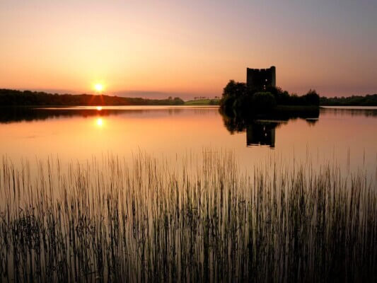 a castle in the middle of a lake Cavan: Ireland's Lake County