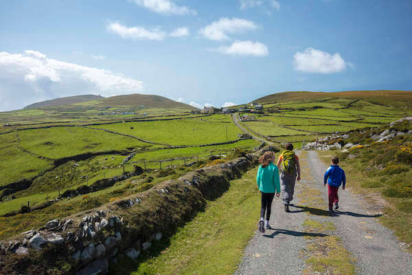 people walking along a road how to plan a trip along the Wild Atlantic Way