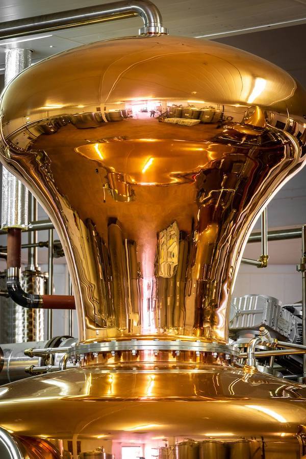 a large copper vat 8 whiskey distilleries