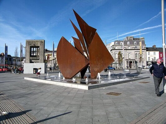 a fountain in a square choosing accommodation in Ireland