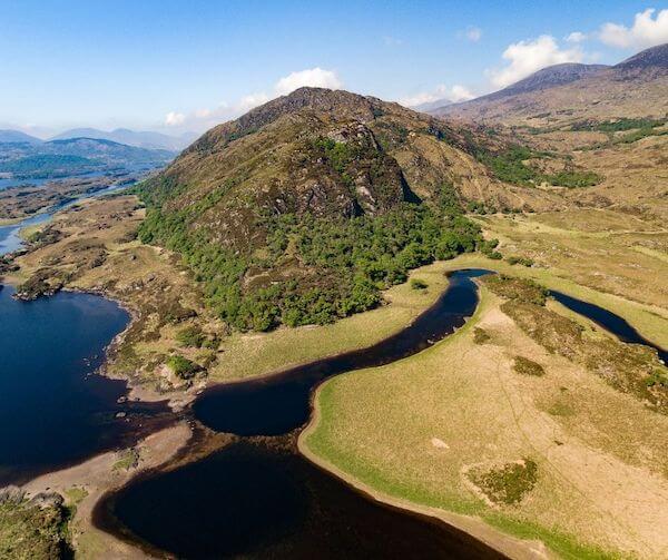 an aerial view of mountains and water how to plan a trip along the Wild Atlantic Way