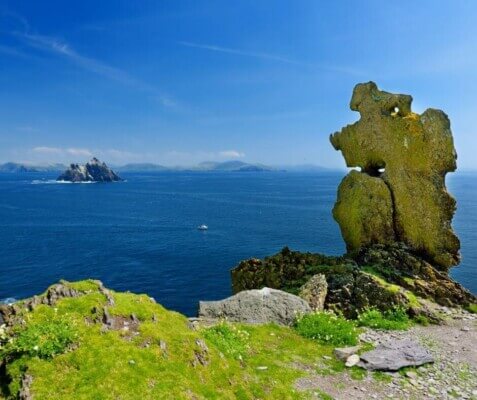 view of the ocean and a faraway island Skellig Michael reopens