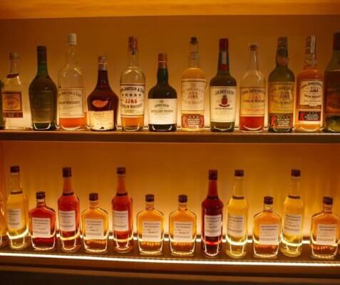 bottles of whiskey on shelves Jameson Distillery Bow St.