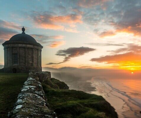 a temple overlooking the ocean CS Lewis attractions in Ireland