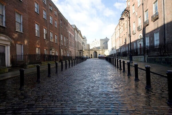 a cobble-stoned street 7 historical attractions in Dublin