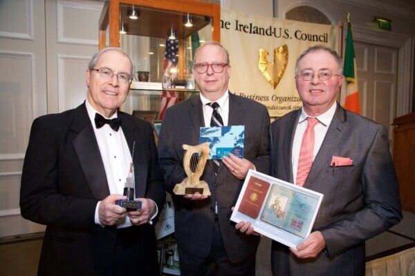 three men with plaques and a book County Mayo author