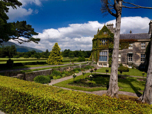 gardens in front of a large house 10 money-saving tips on getting to Ireland