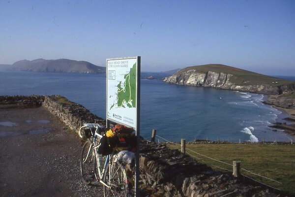 a bicycle up against a wall near the ocean experience the great blasket island