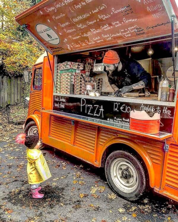 a child standing outside a food truck the top 20 Irish food trucks