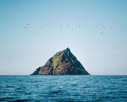 a rocky island in the sea traveling to Ireland in 2021