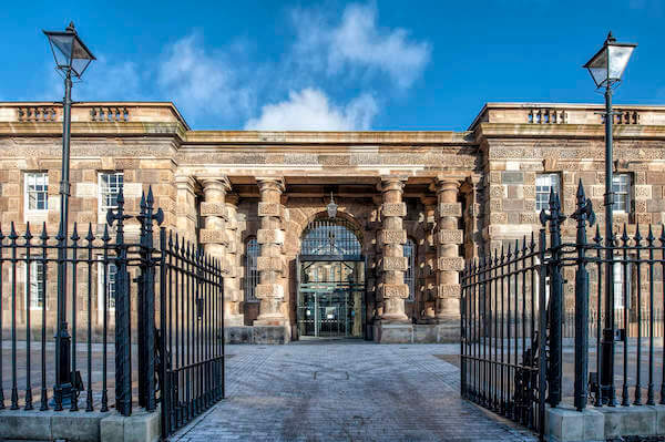 open gates to a building courtyard using public transportation to see Ireland