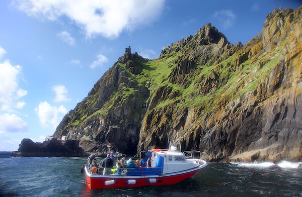 a boat near an island 4 Ireland itinerary ideas