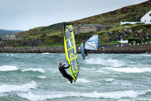 people kite surfing in ocean travel insurance explained