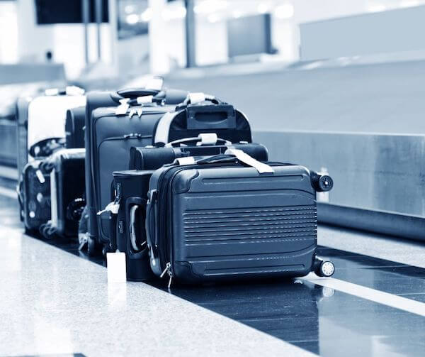 suitcases at an airport Black Friday and Cyber Monday