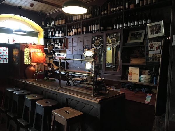 wooden stools and counter 14 of Ireland's oldest pubs