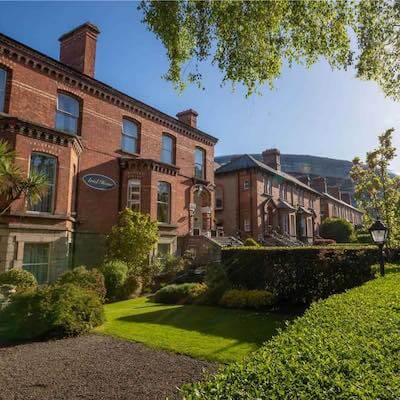 a brown building with a garden in front 10 days in Ireland