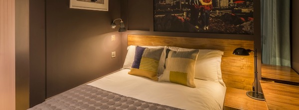 two pillows on a bed 10 affordable hotels in Belfast