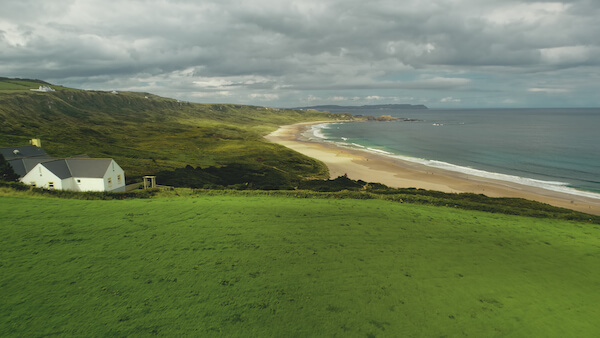 a beach and green fields how much does a trip to Ireland cost
