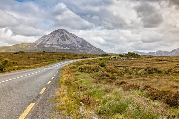 a road leading to a mountain 10 things to do in Ireland