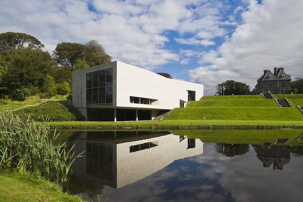 a white building by water 10 things to do in Ireland