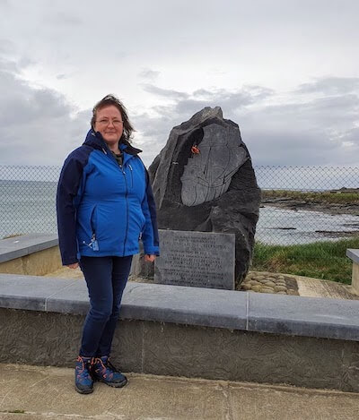 a woman standing by a monument Experiencing Ireland Tours