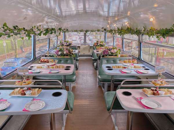 tables set for tea on a bus enjoy an afternoon tea