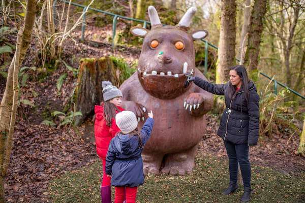 a woman with children near a sculpture Halloween in Ireland