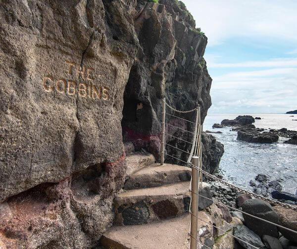 steps leading into a cave 10 day trips from Belfast