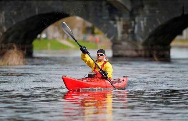a man kayaking on a river Ireland's midlands