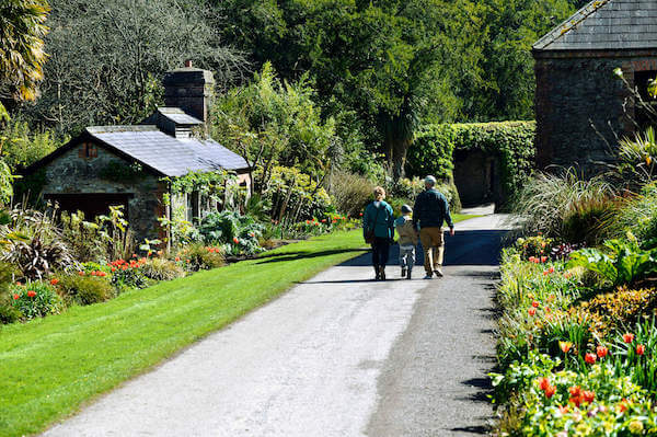 people walking on a pathway in a garden 12 of the most beautiful gardens in Ireland